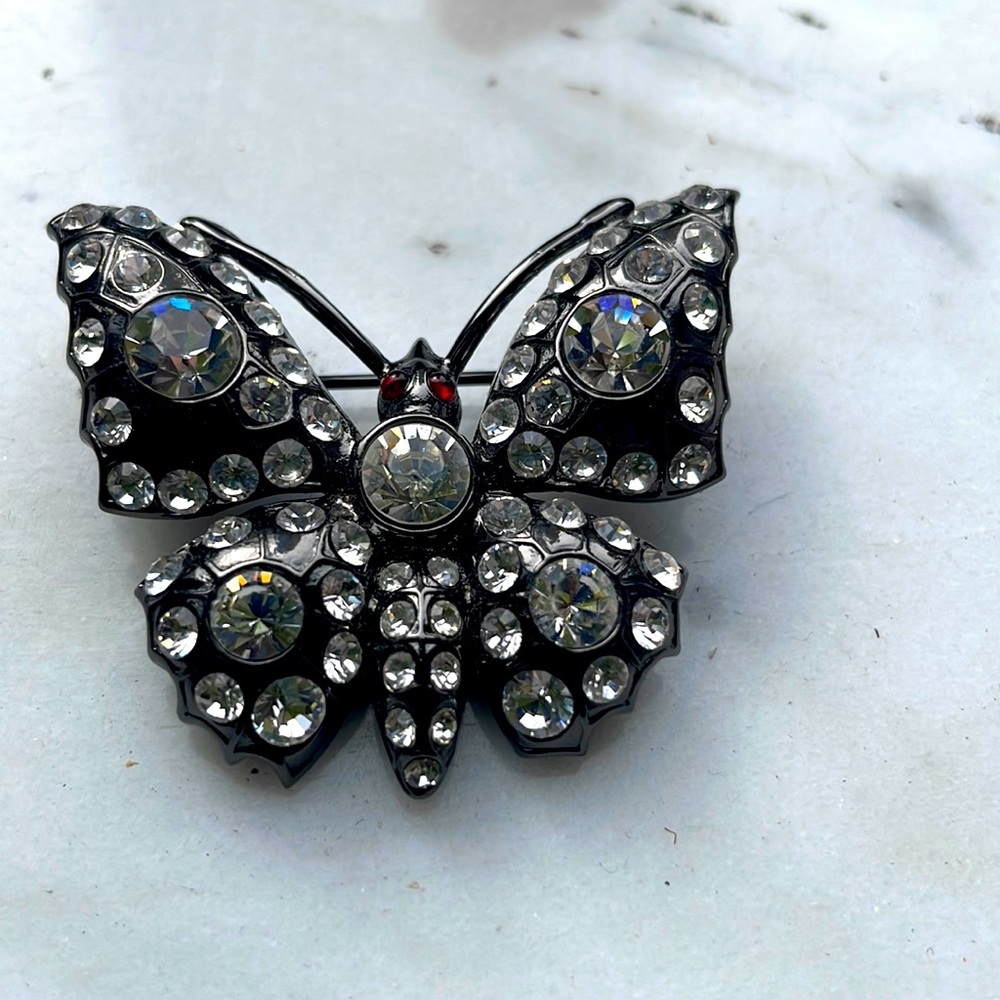 Butterfly brooch in black metal with Swarovski crystals and red cabochon eyes